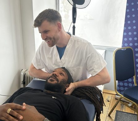 Man receiving treatment on neck
